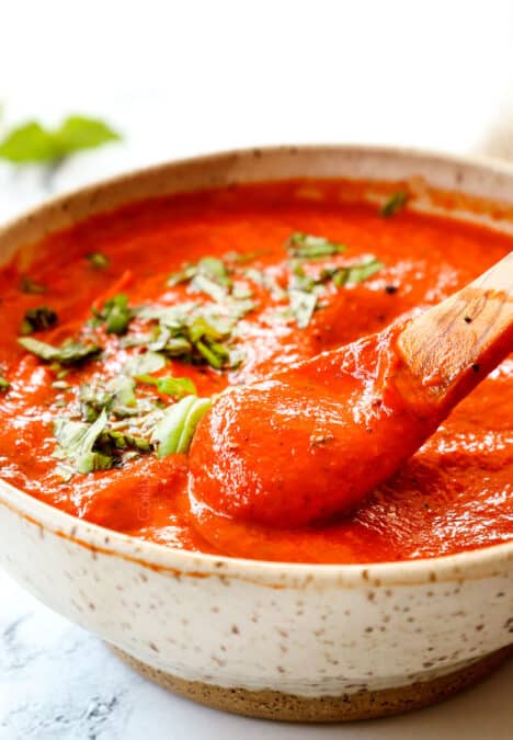 a spoonful of roasted red pepper sauce recipe showing how smooth it is