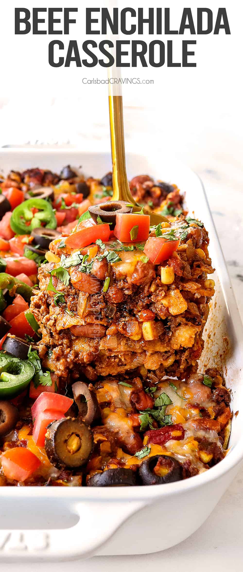 up close of a slice of beef enchilada casserole showing the different layers