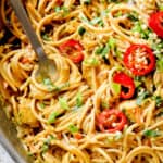 up close of Peanut Noodles in a skillet showing how creamy it is