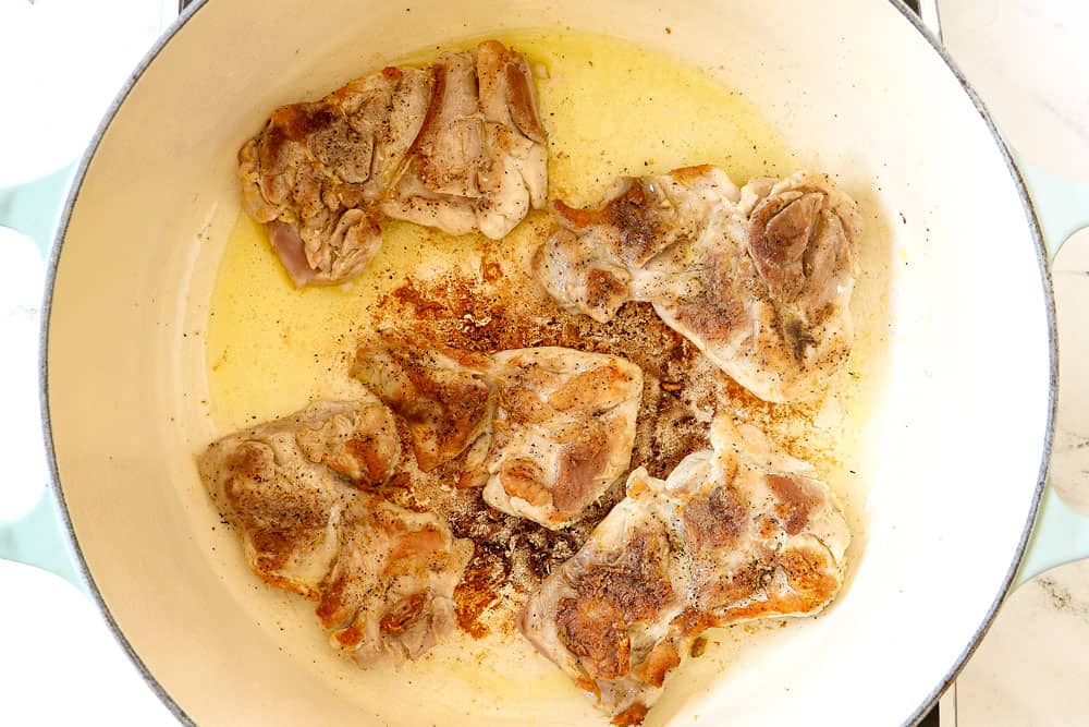 showing how to make Chicken Enchilada Soup by searing chicken thighs in a Dutch oven