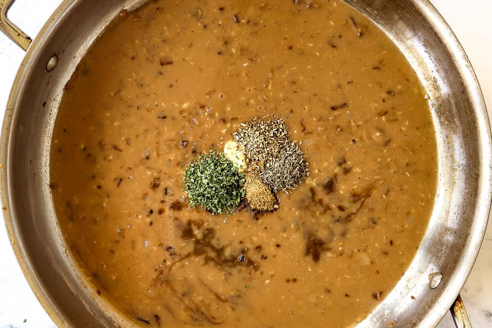 showing how to make homemade Salisbury steak by adding beef broth, parsley, oregano and beef bouillon to a skillet