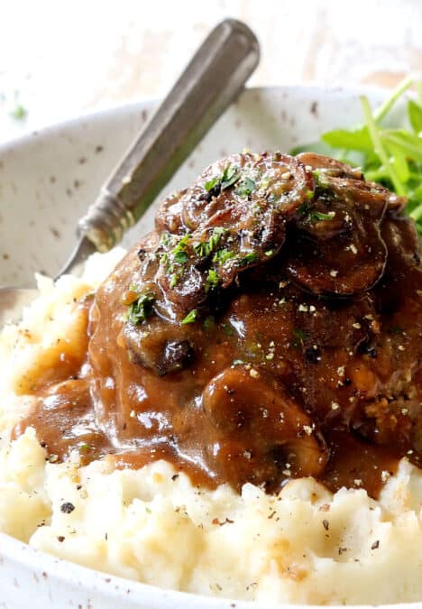 up close of homemade Salisbury Steak on mashed potatoes