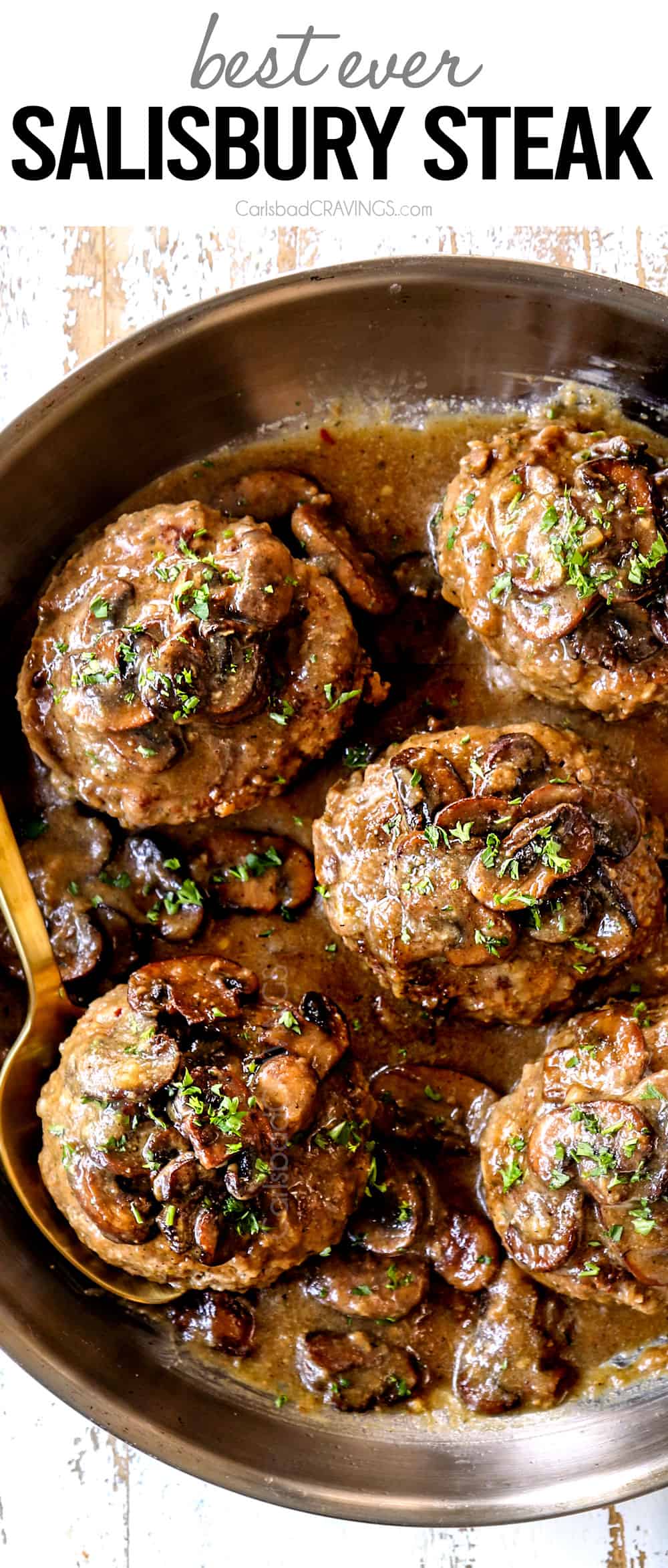 top view of Salisbury steak in a skillet with mushroom gravy