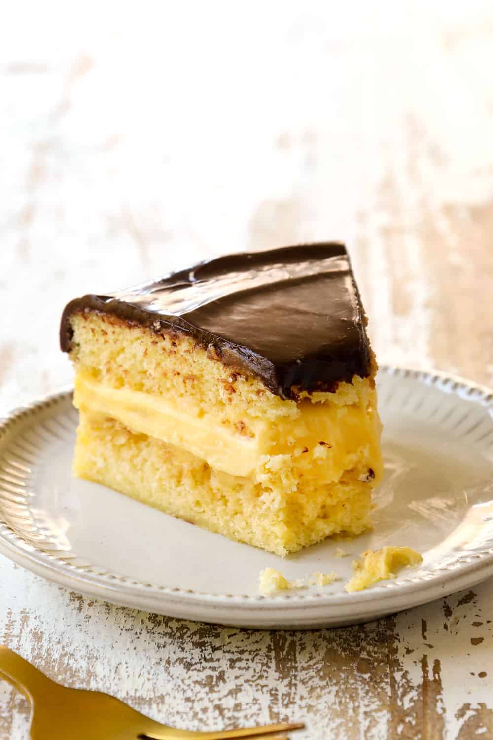 up close of a bite taken out of Boston Cream Pie