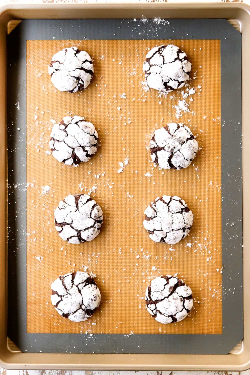 top view of crinkle cookies coming out of the oven showing the crinkled top