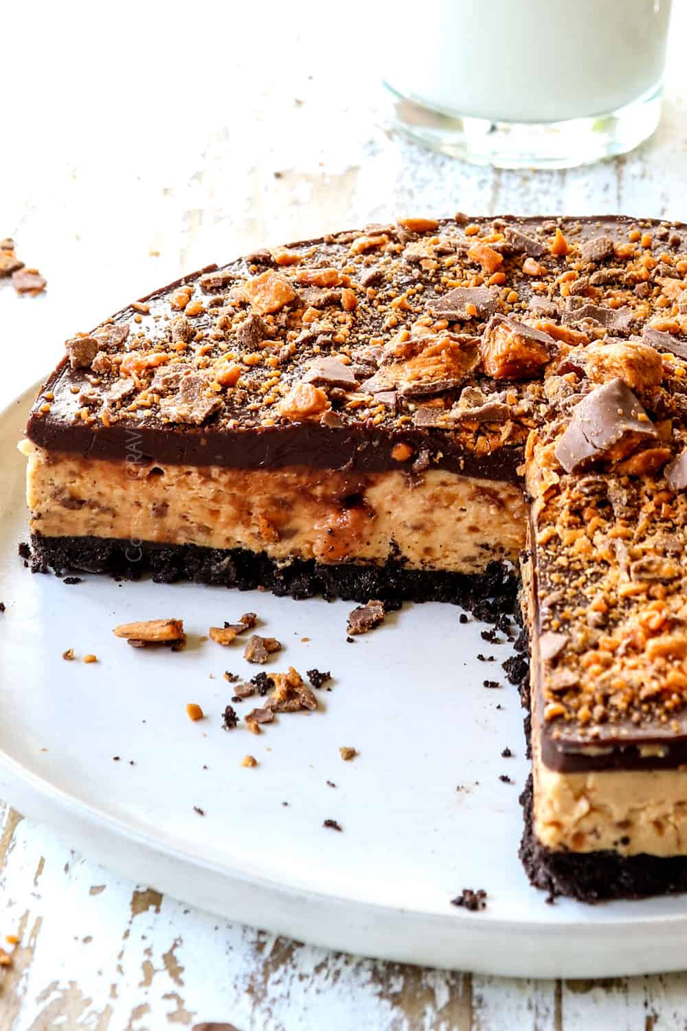 up close of Butterfinger Pie with two slices take out of it