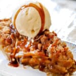 a slice Dutch Apple Pie with ice cream and caramel sauce