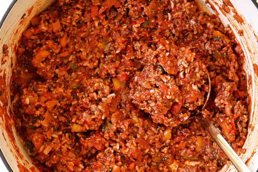 showing how to make stuffed peppers recipe by stirring together filling ingredients