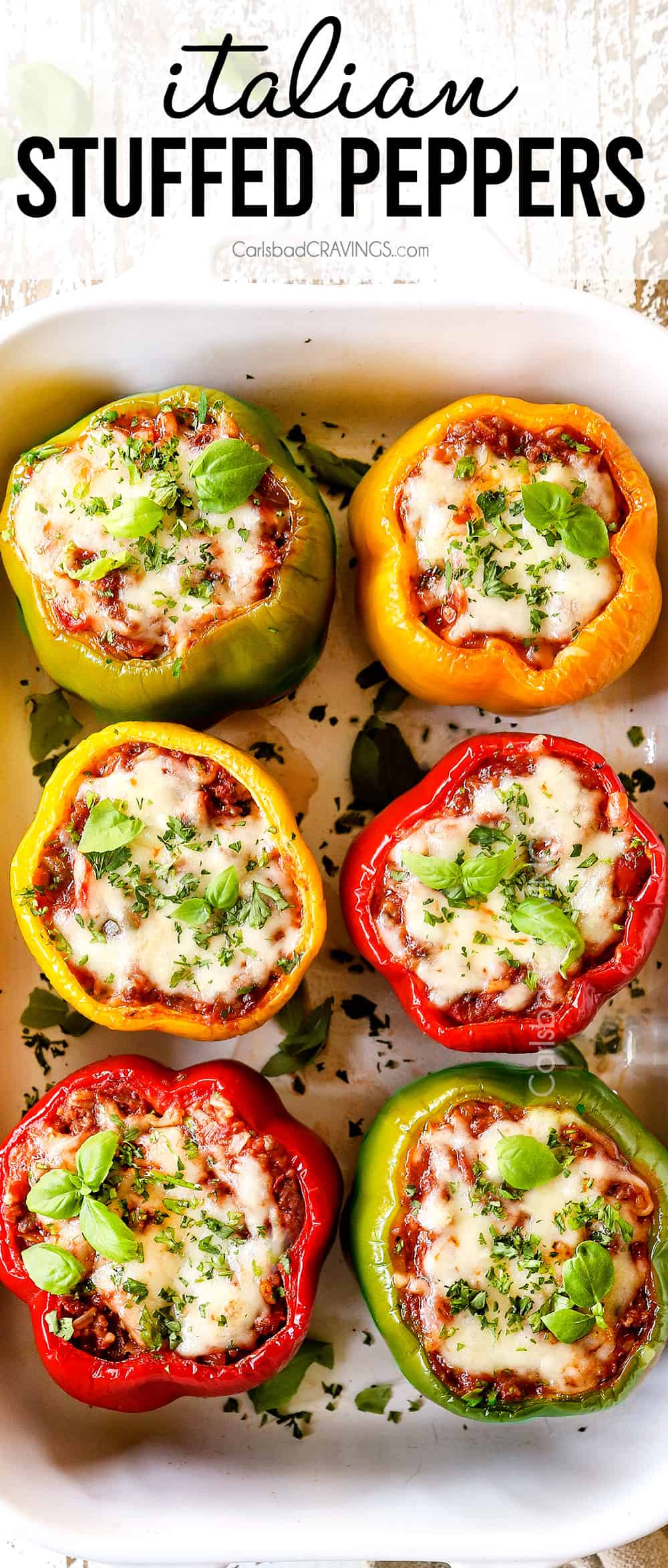 top view of stuffed peppers with Italian sausage, rice and tomatoes covered in mozzarella