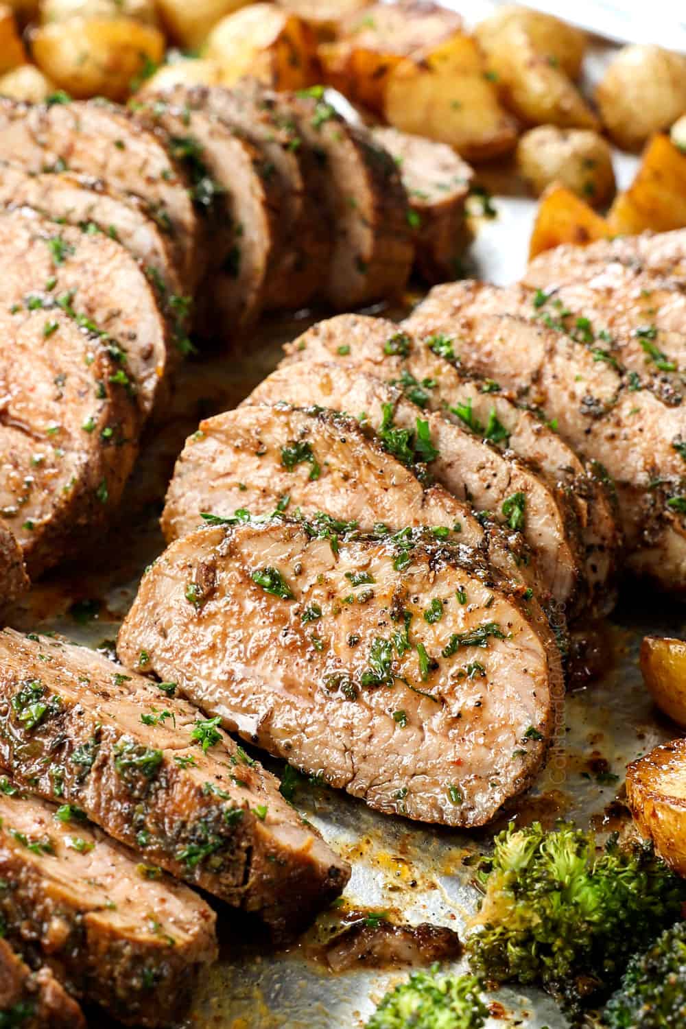 up close of a slice of roasted balsamic pork tenderloin roasted topped with balsamic sauce