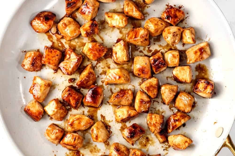 showing how to make healthy chicken teriyaki stir fry recipe by browning chicken in a skillet