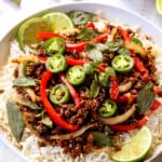 showing how to serve Thai Basil Beef (pad krapow) by serving in a bowl over rice
