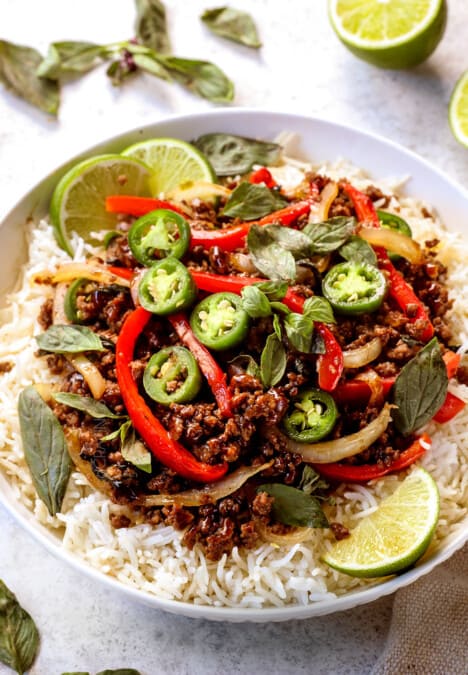 showing how to serve Thai Basil Beef (pad krapow) by serving in a bowl over rice