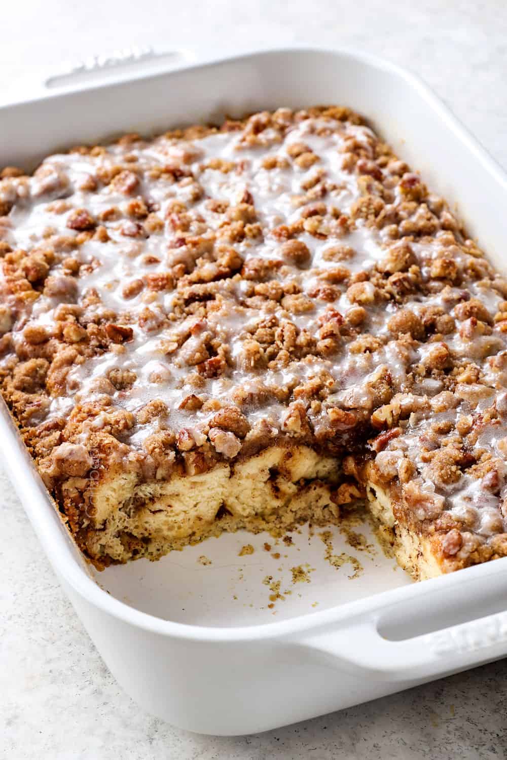 cinnamon roll French toast bake with a slice cut out