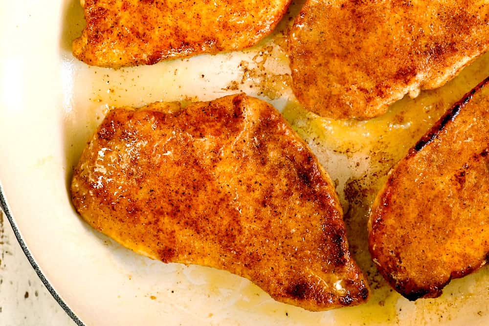 showing how to make garlic chicken recipe by searing the chicken until golden brown