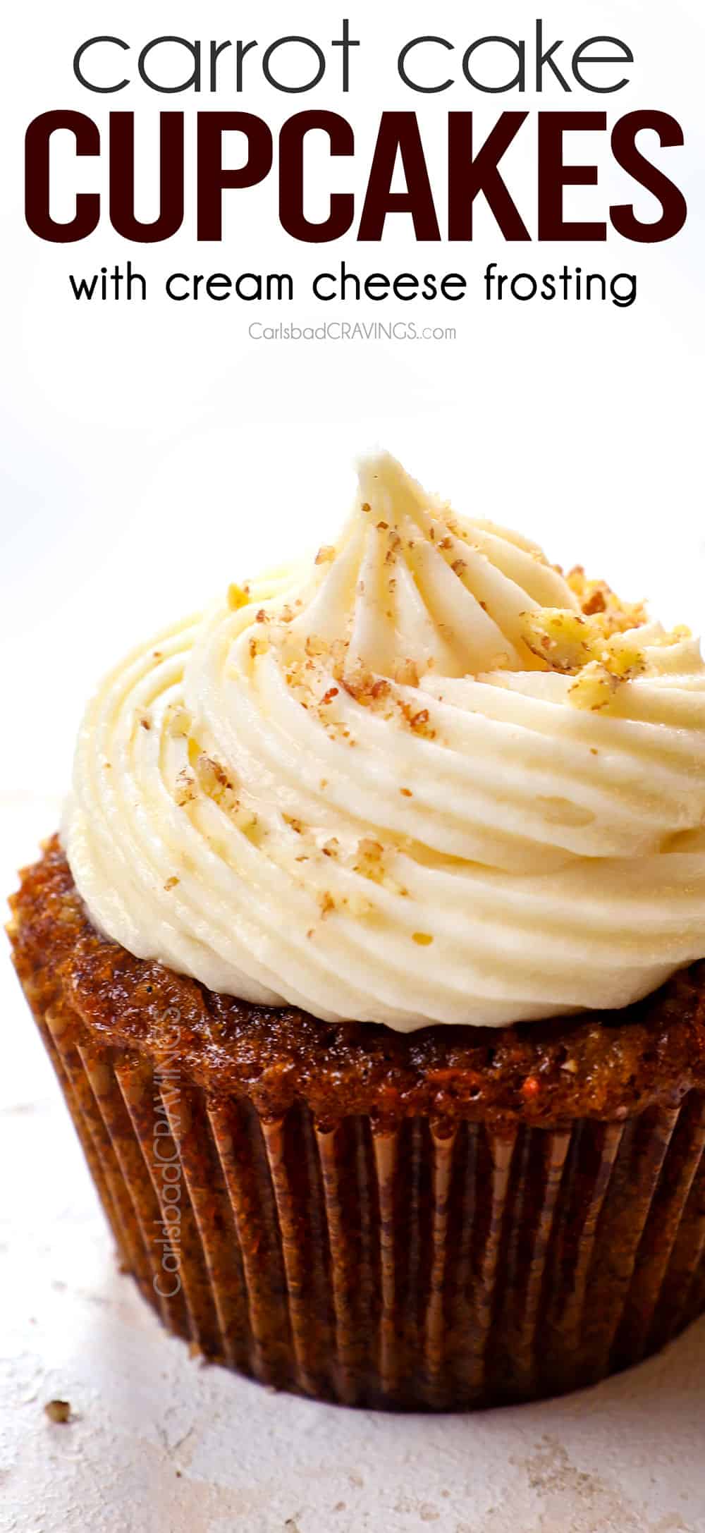 up close of carrot cake cupcake with cream cheese frosting