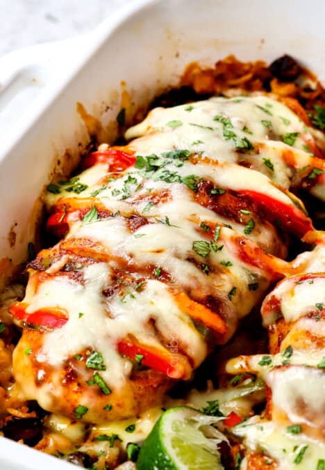 up close of a piece of Hasselback chicken topped with cheese