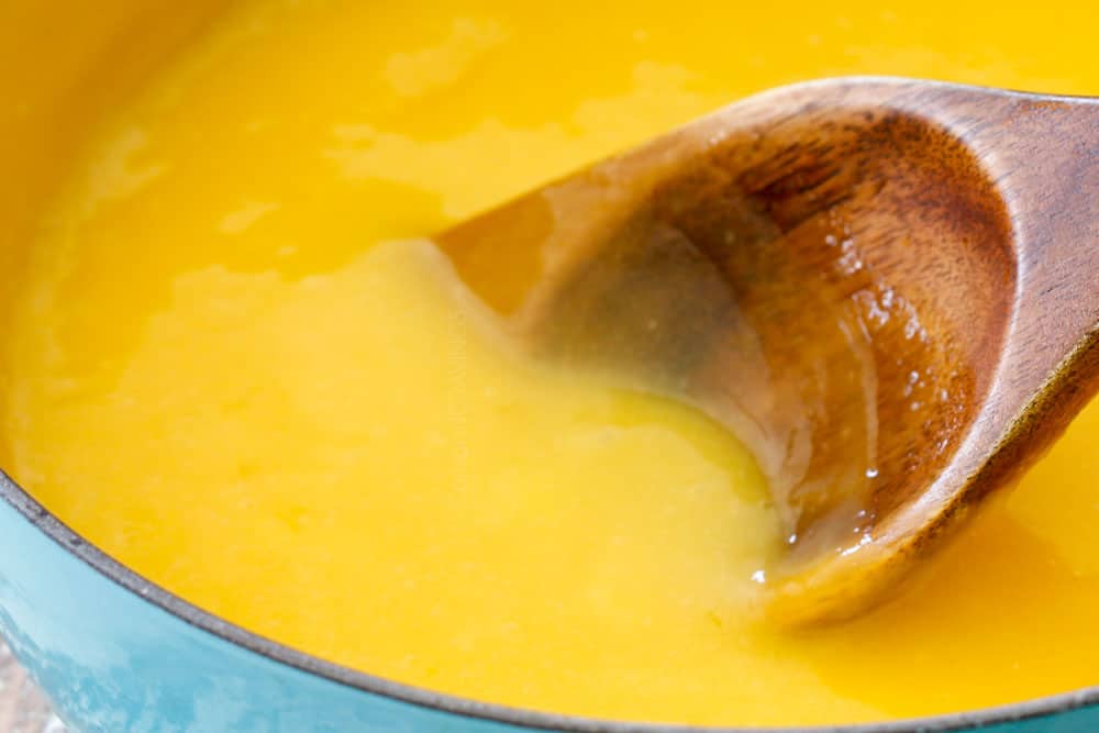 showing how to make lemon curd by stirring constantly until thickened