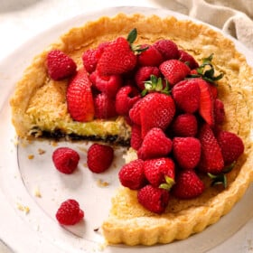 a few slices missing from coconut pie showing the custard filling