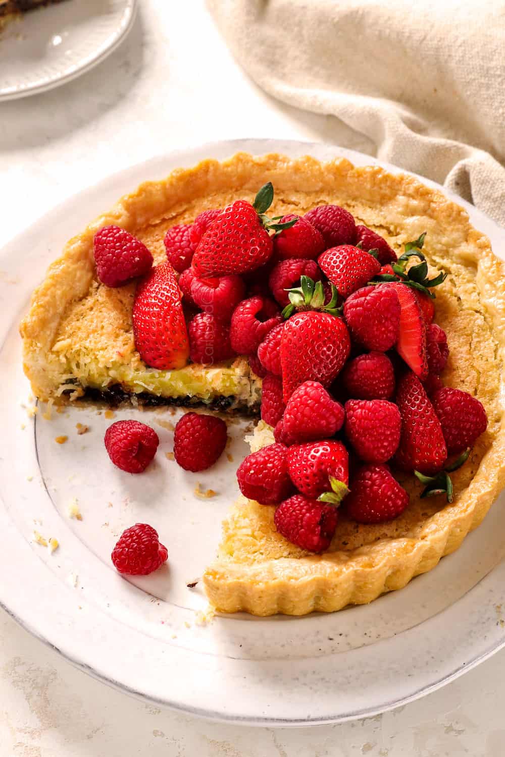 a few slices missing from coconut pie showing the custard filling