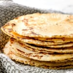 corn tortilla recipe stacked showing how soft and thin they are