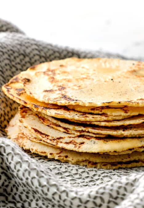 corn tortilla recipe stacked showing how soft and thin they are
