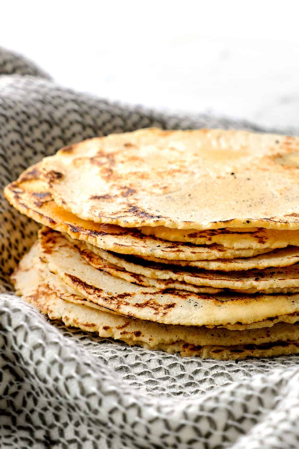 corn tortilla recipe stacked showing how soft and thin they are