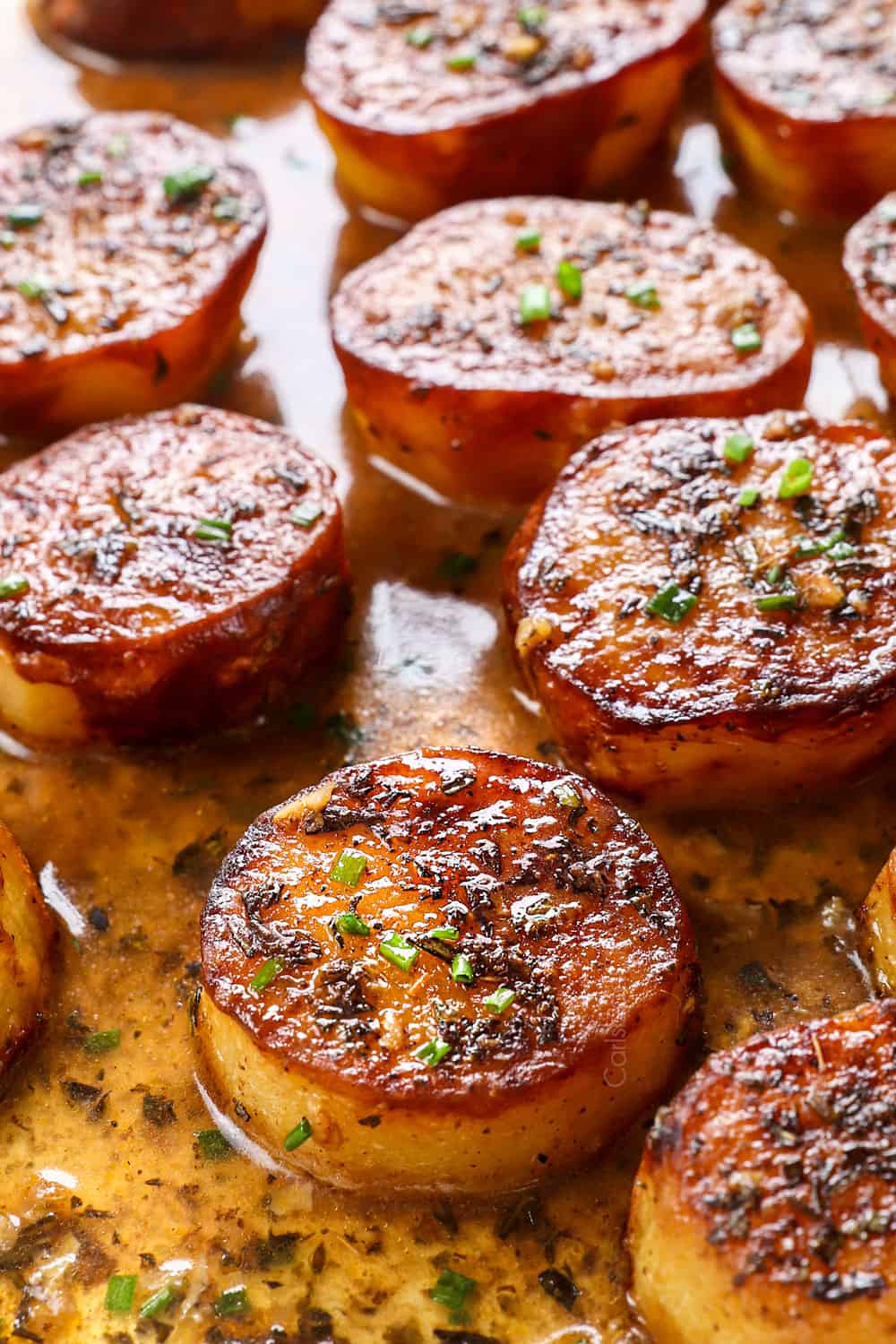up close of melting potatoes recipe showing how caramelized the potatoes are