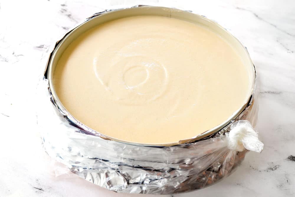 showing how to waterproof cheesecake by placing the springform pan in the center bottom of aย slow cooker liner and tying it tight