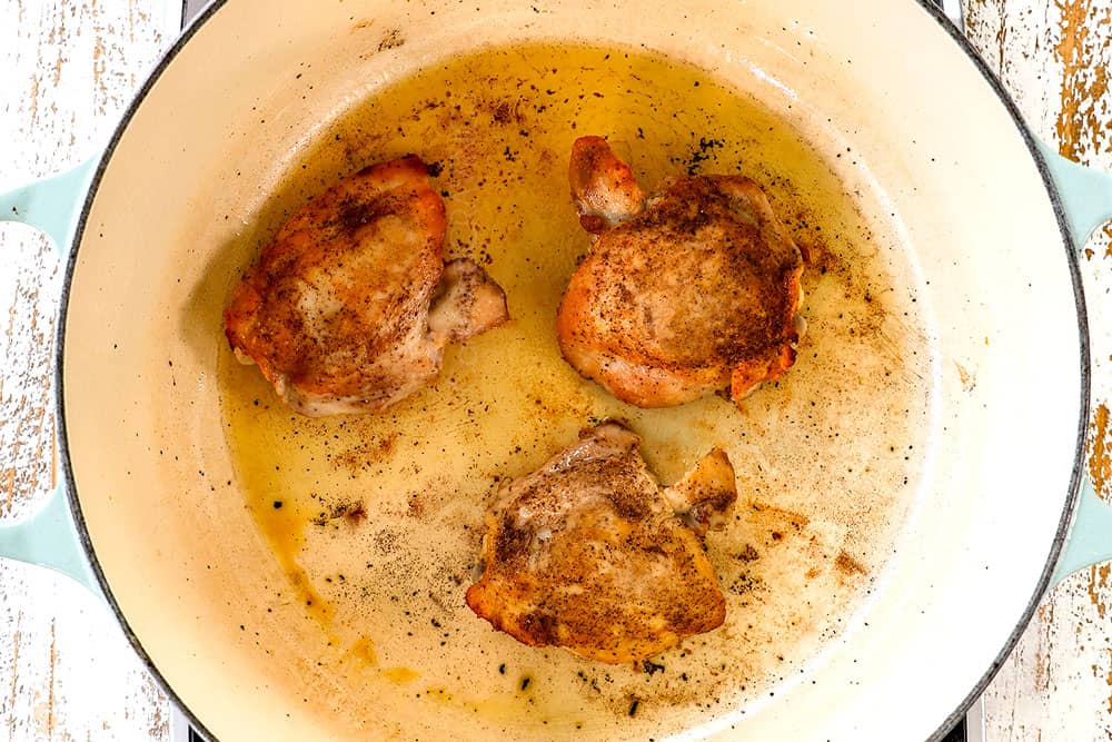 showing how to make matzo ball soup by searing chicken in a Dutch oven