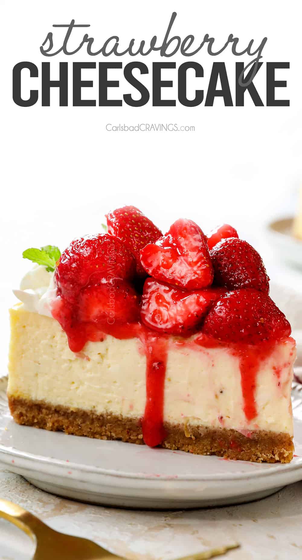 front view of a slice of strawberry cheesecake showing the glazed strawberry topping