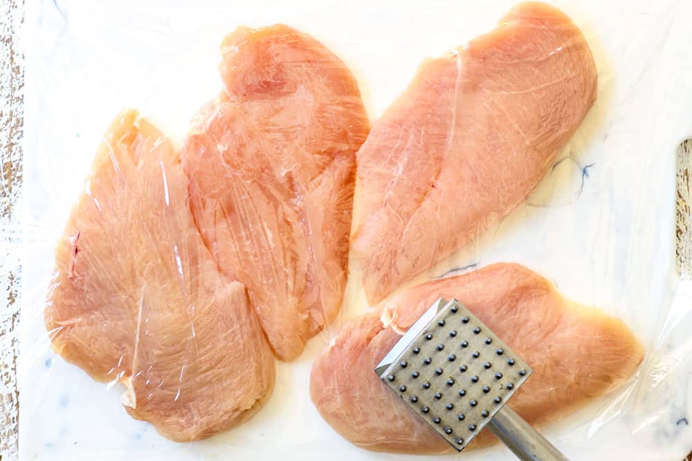 showing how to make chicken fettuccine Alfredo recipe by pounding chicken cutlets into fillets with a meat mallet