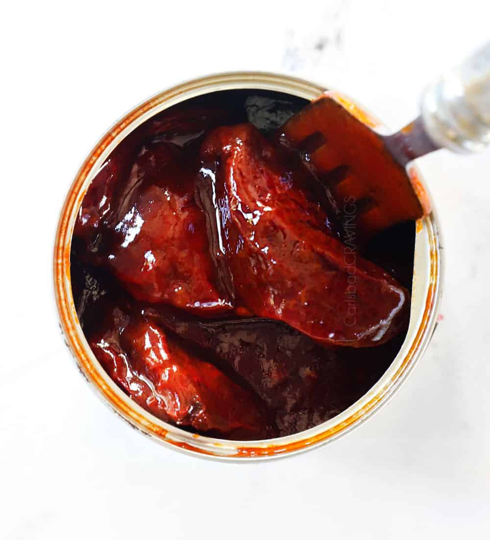 showing what chipotles in adobo look like with an open can to make chipotle crema