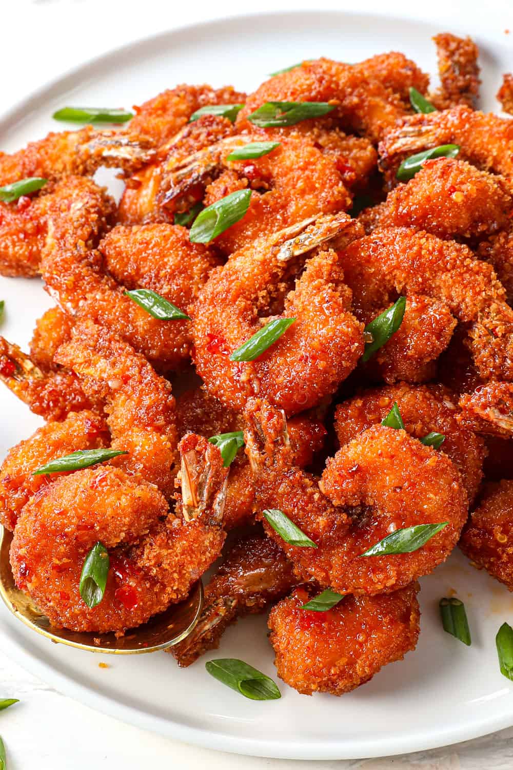 a plate of firecracker shrimp coated in panko