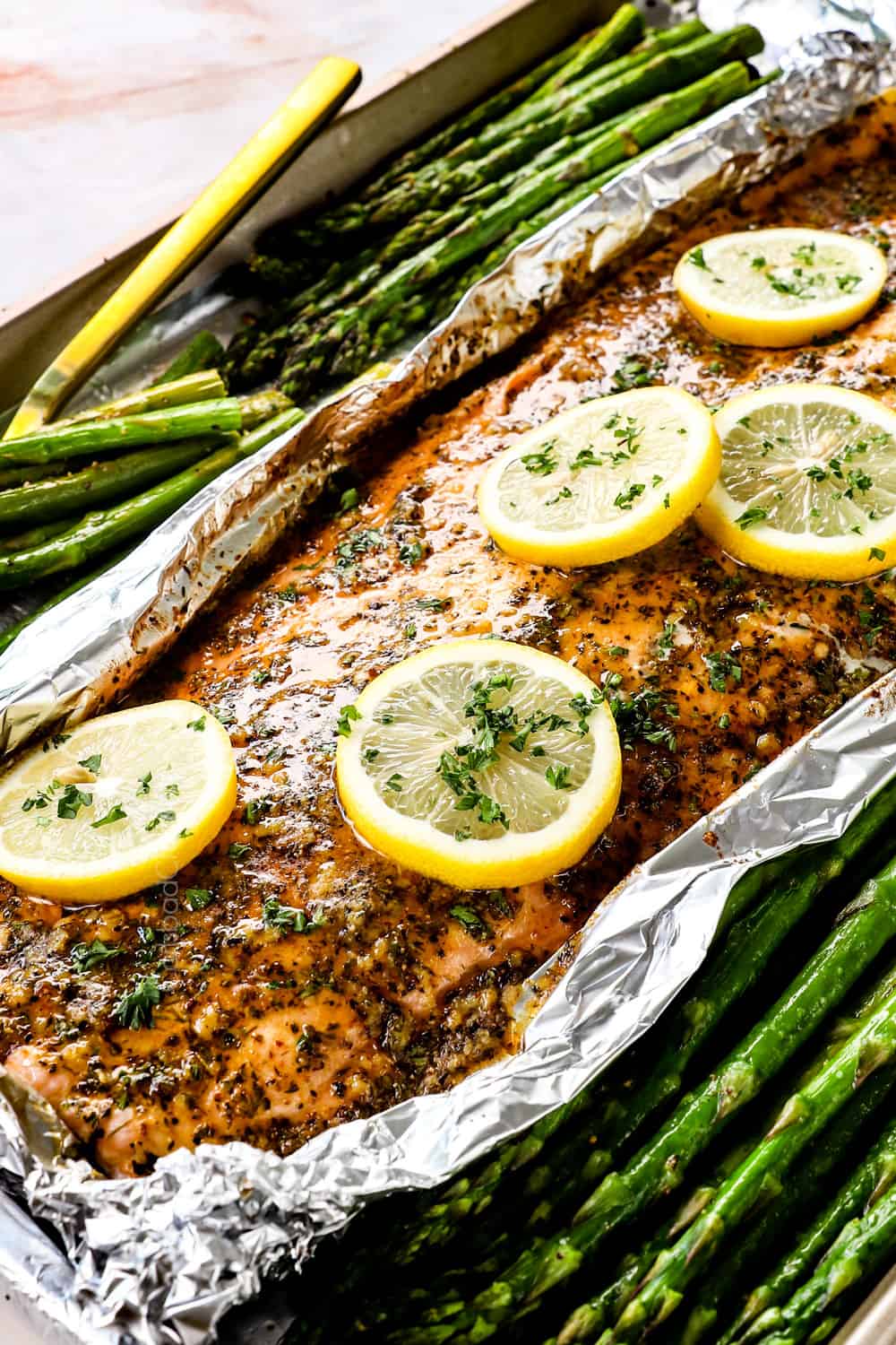 up close of baked lemon pepper salmon recipe with garlic lemon pepper butter