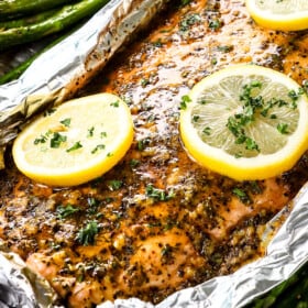up close of baked lemon pepper salmon recipe with garlic lemon pepper butter