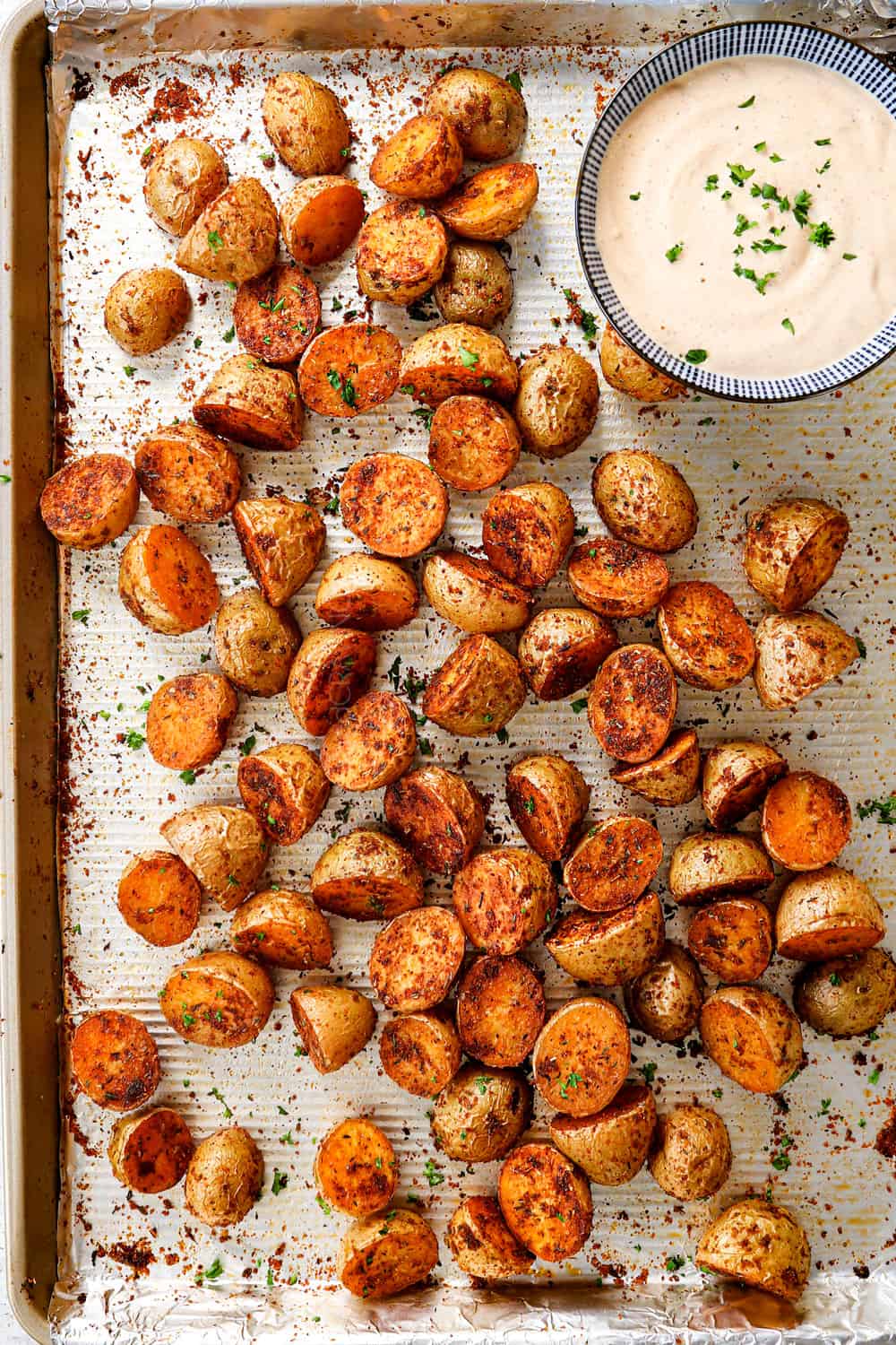 showing how to make roasted Cajun potatoes by baking in the oven until tender and crispy