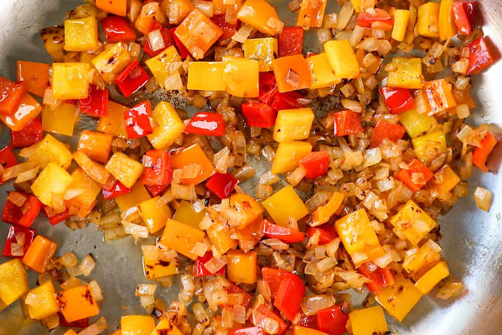 showing how to make Sausage Peppers Pasta recipe by sautรฉing bell peppers until crisp tender