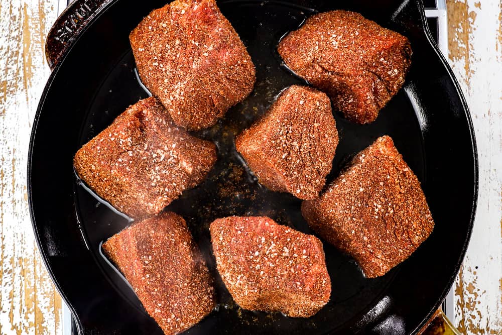 showing how to make taquito recipe by searing beef in a cast iron skillet