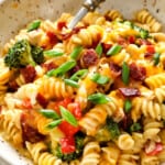 showing how to serve chicken bacon ranch casserole by adding to a bowl and topping with bacon