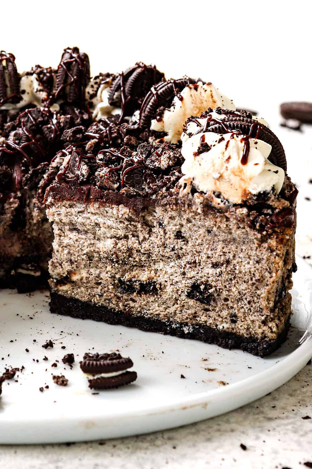 slices of Oreo cheesecake on a white platter