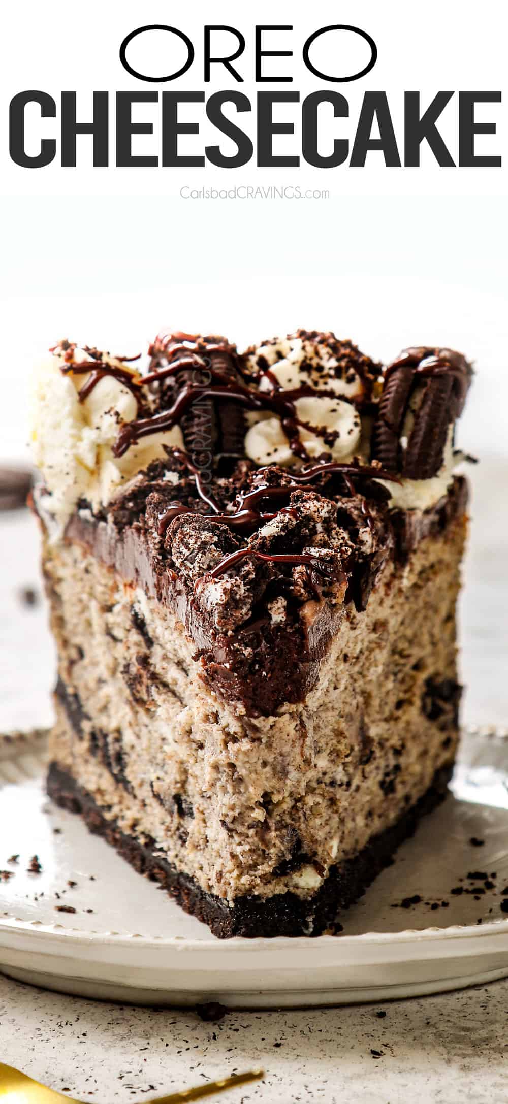 up close front of a slice of cheesecake with chocolate ganache