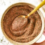 showing how to make Jamaican jerk seasoning by whisking the spices together in a bowl