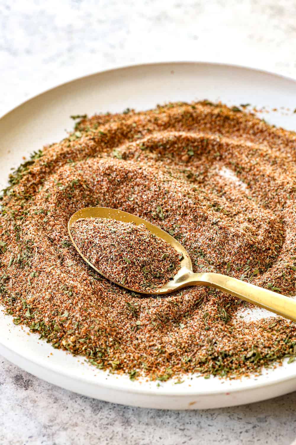 a spoon scooping up jerk seasoning recipe