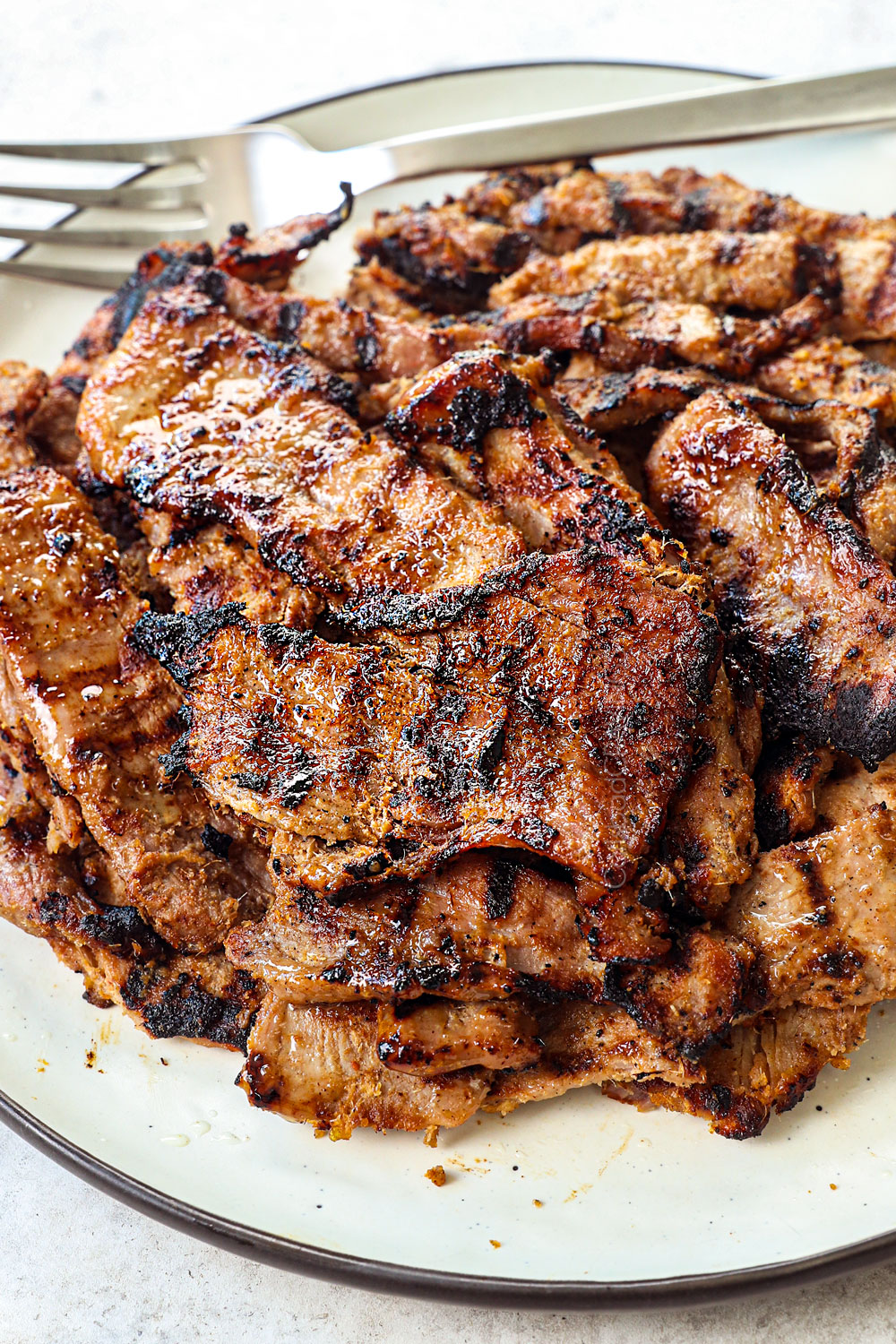 showing how juicy the thinly sliced grilled pork tenderloin is for Banh Mi Vietnamese Sandwich