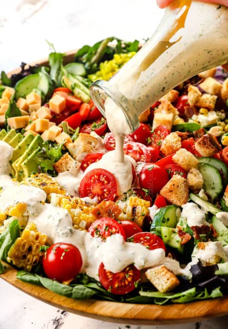 up close of pouring homemade ranch dressing recipe showing how creamy it is