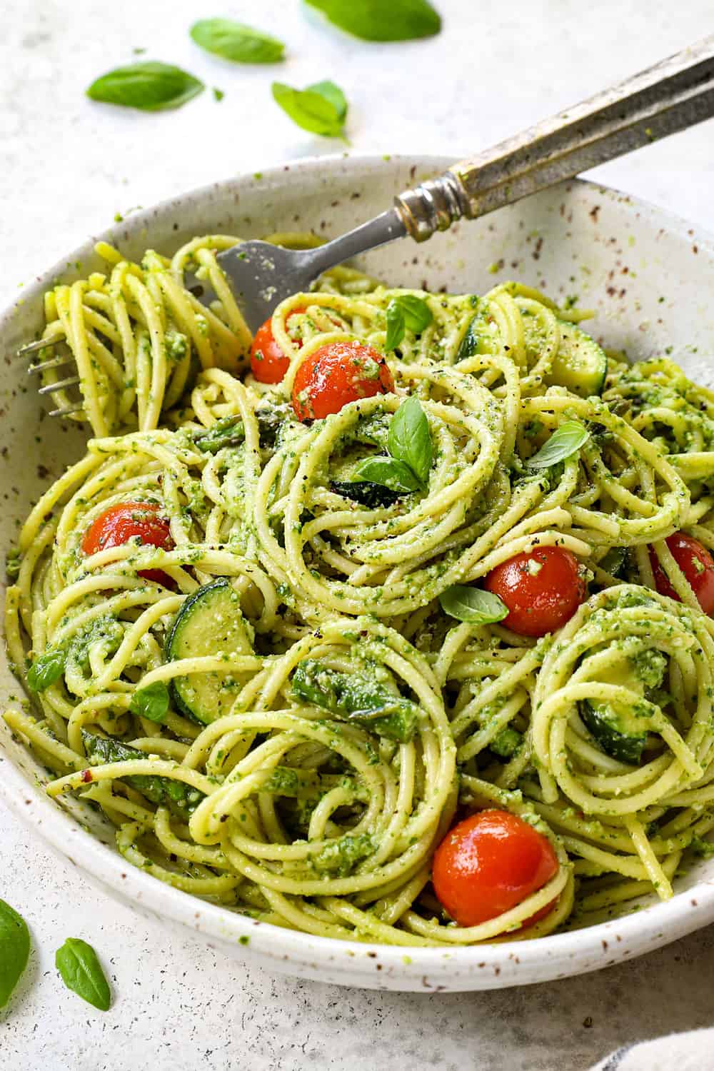 a bowls of pesto pasta with basil pesto
