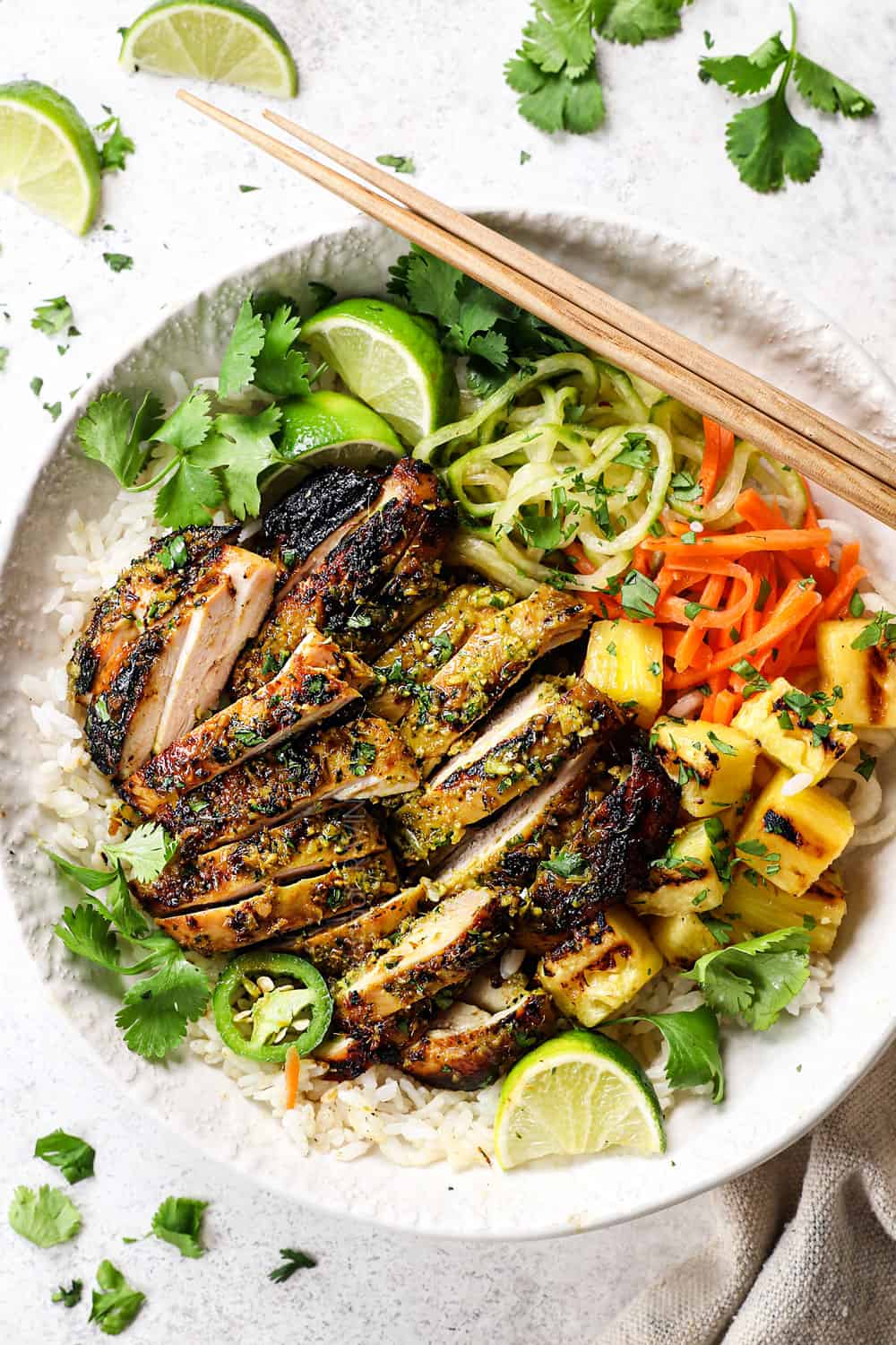 top view Thai chicken sliced and served over rice with pickled vegetables