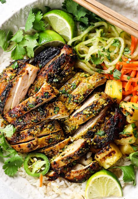 top view Thai chicken sliced and served over rice with pickled vegetables