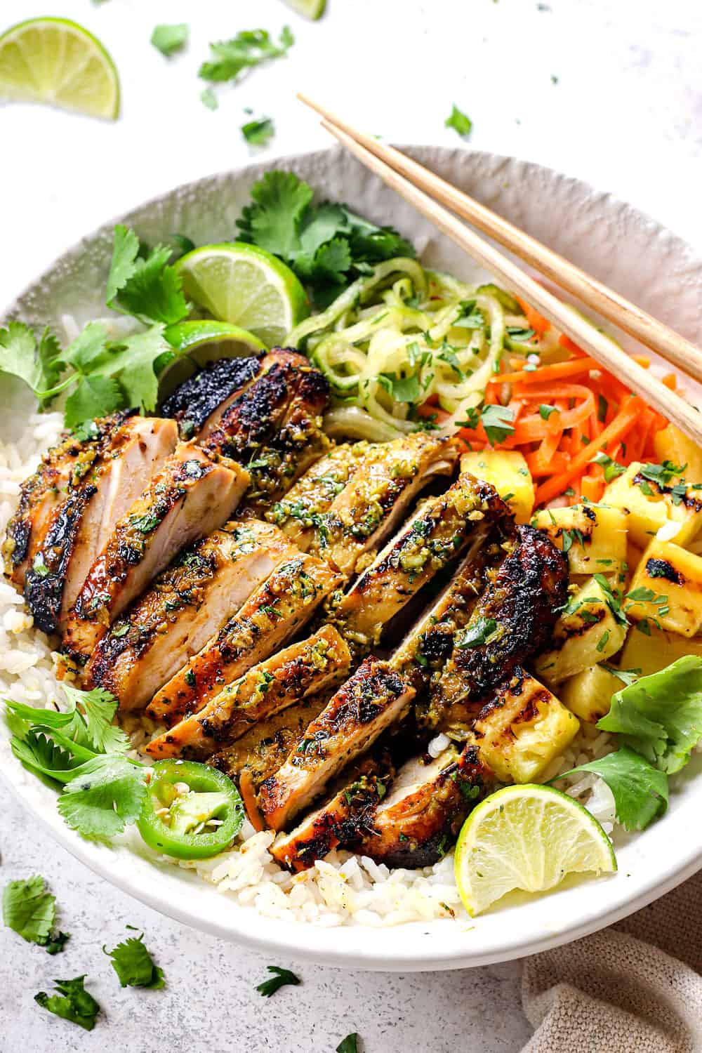 serving sliced Thai chicken in a bowl with rice